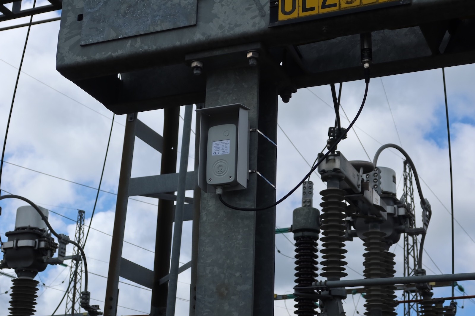 Overhead power lines crossing woodland